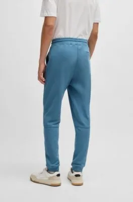 Pantalones de chándal en felpa de algodón con parche de logo