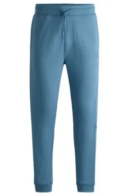 Pantalones de chándal en felpa de algodón con parche de logo